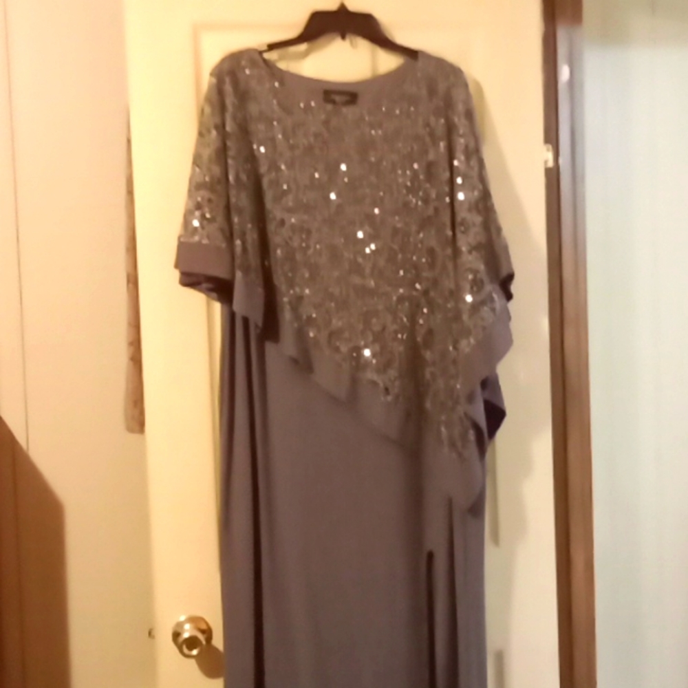 Beautiful dress. Sequins on top with slit on bottom. 5 ft. Long. Size 18 W